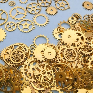 Detailed close-up of golden steampunk mechanical gears for DIY jewelry making and crafts