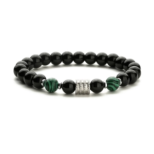 Detailed view of men's beaded bracelet with black stones and tiger eye accents