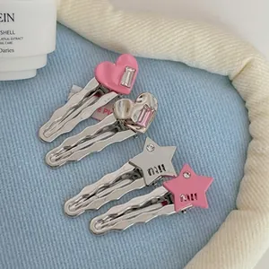 Set di quattro fermagli per capelli a forma di stella e cuore con cristalli