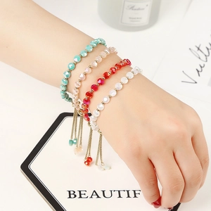 Adjustable faceted crystal bead bracelets in four colors with gold tassel details