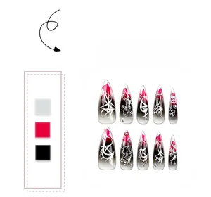 Detail of stiletto press-on nails with dark gothic cross and red ombre drip design