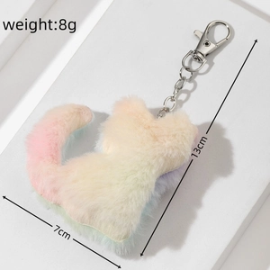 Detail view of 8g rainbow plush cat keychain with silver carabiner and size measurements