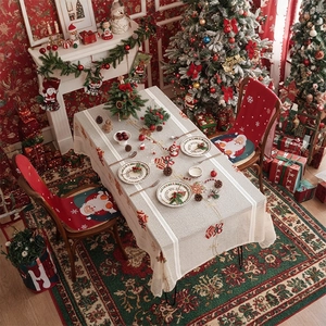 Christmas tablecloth with bells and snowflake patterns on a festive holiday table setup