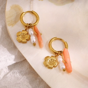 18K gold plated hoop earrings featuring flower pendants, pearls and coral beads on a shell