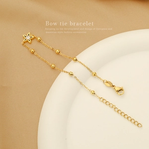 Elegant gold star bracelet with zircon inlay on a silk background for women