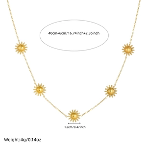 Detail view of gold sun pendant necklace with dimensions 40cm+6cm and 1.2cm diameter