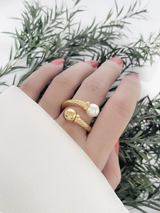 Detail of twisted cable ring in 18K gold finish with pearl and gold bead accents