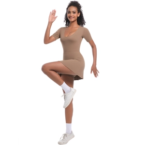 Detail of a slim-fit coffee-brown tennis romper dress with short sleeves and a crew neck
