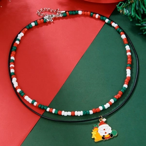 Detailed close-up of double-layer Christmas necklace with seed beads and Santa pendant