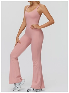 Detail view of dusty pink flared yoga jumpsuit with high waist and backless design
