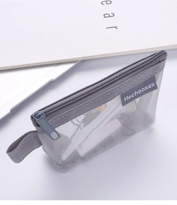 Close-up of a grey mesh zipper pouch showing the high-quality texture and brand label