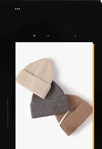 Detailed view of rib-knit beanie hats in beige, dark grey, and khaki autumn styles