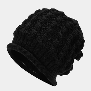 Detail of black honeycomb knit beanie with stylish rolled edge and thick texture