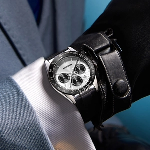 Kimsdun silver and white chronograph watch for men with black leather strap on a suit wrist