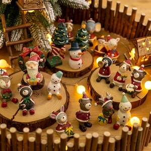 Miniature Christmas resin figurines with Santa and animals for festive tabletop decor