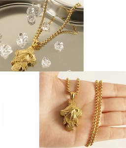 Detail of 18K gold stainless steel eagle pendant necklace with 365-day color retention