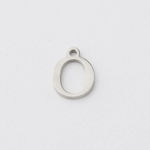 Macro view of polished silver stainless steel letter O pendant with hanging loop