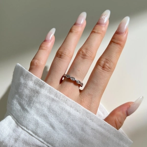 Close-up of S925 sterling silver ring with marquise-cut stones on a finger