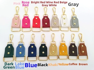 Close-up of 15 colorful leather connector charms with gold lobster clasps and hardware