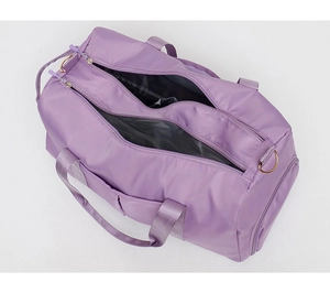 Detail view of purple gym bag featuring water-resistant nylon fabric and large opening