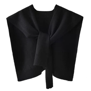 Detailed texture of black core-spun yarn knitted shawl with classic knot design
