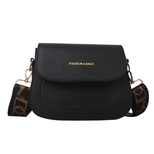 Fashionable black faux leather saddle bag with crocodile texture and wide patterned strap