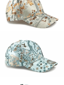 Detailed macro view of ethnic style jacquard brocade baseball caps in gold and light blue