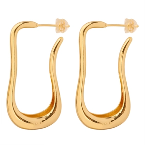 Minimalist golden U-shaped wavy metal earrings with silicone backs on white background