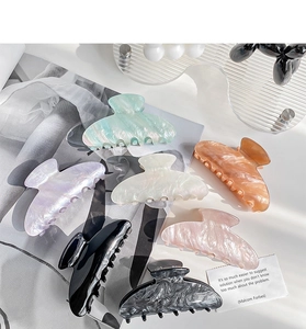 Detailed collection of large acetate hair claws in various solid and marble colors