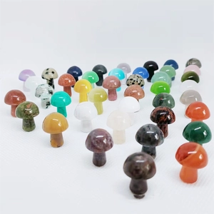 Close-up of small mushroom-shaped natural stone pendants in various vibrant colors