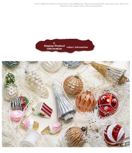 Macro detail of Christmas glass ornaments with hand-painted glitter on snowy cedar branches