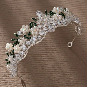 Floral bridal tiara with silver metal base, crystals, pearls, and green enamel leaves