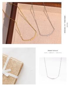 Detailed view of smiley curve necklace with micro-set zircons in gold and silver finish