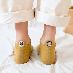 Pale yellow cotton ankle socks featuring cute dog and bear embroidery on heels