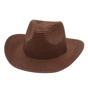 Brown woven western cowboy straw hat with wide curved brim for sun protection and style