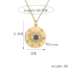Detail view of gold evil eye necklace with blue zircon and exact size measurements