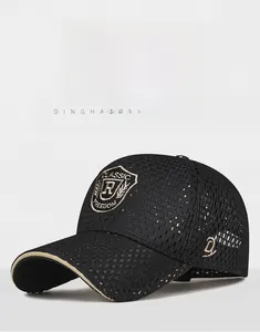 Detailed embroidery on a black mesh baseball cap featuring a golden shield badge logo