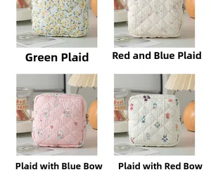 Close-up of four floral and animal patterns on quilted menstrual pad storage bags