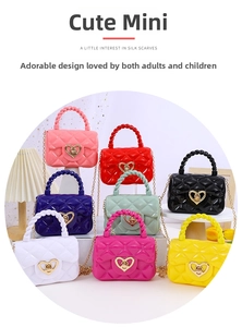 Detail of mini jelly handbags with heart buckles and chain straps in multiple colors