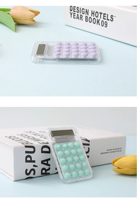 Detail view of mini transparent calculators in purple and mint green with round buttons