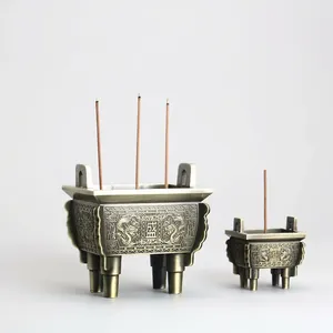 Quemadores de incienso de bronce antiguo con relieve de dragón y diseño tradicional de cuatro pies