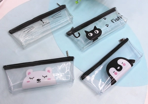 Detailed view of four transparent PVC stationery pouches with cute cartoon animal prints