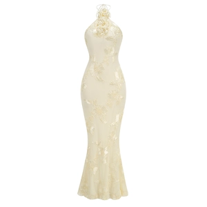 Detail of elegant cream halter dress featuring 3D floral embroidery and fishtail silhouette