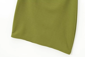 Detail shot of the olive green dress hem showing high-quality stitching and fabric texture