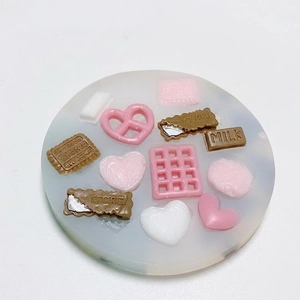 Silicone mold featuring chocolate cookie and heart shapes for baking and resin crafts