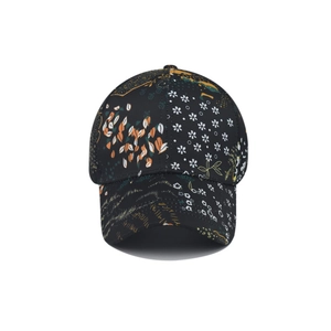 Close-up of floral digital print details on a black tie-dye baseball cap fabric