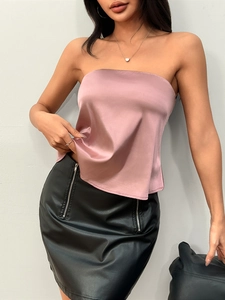 Chic pink satin tube top paired with a black faux leather mini skirt with double zippers