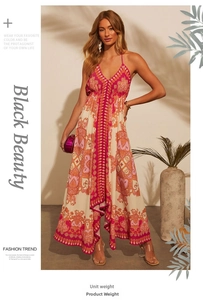Close-up of bohemian paisley printed maxi dress with deep V-neck and halter strap detail