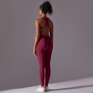 Close-up of seamless burgundy yoga jumpsuit with open back and cross straps design