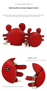 Macro shot of red oil wax leather texture and golden metal chain on crab-shaped coin purse